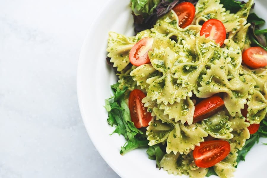 A bowl of pasta and a glass of wine